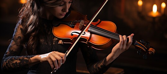 Passionate female musician playing violin with intricate details, evocative expression