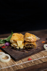 risoles filled with various variants, indonesian food, coating with bread crumb, decorated with condiment and garnish.