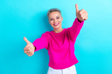 Portrait of satisfied girl with dyed hairdo wear knit sweater showing you thumbs up good job...