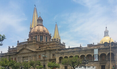 Fototapeta na wymiar cathedral detail in downtown guadalajara, jalisco, mexico (with government building) tapatio, church, columns, dome, tower