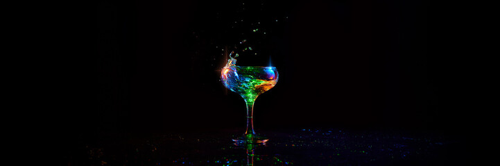 Glass with alcohol cocktail with martini standing against dark background with neon light. Banner. Concept of alcohol drink, nightclub, party, taste, celebration. Empty space to insert text