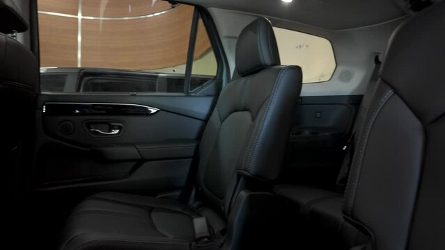 Black leather automobile seats 4k video