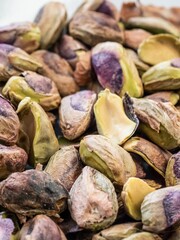 Pile of peeled shelled bare pistachio nuts
