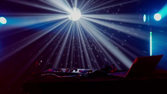 DJ Setup with Vibrant Light Show in Club Atmosphere