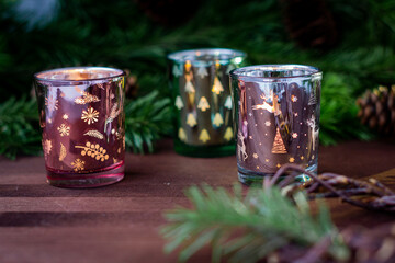 Christmas tinted candlesticks, cups with luminous patterns, New Year's decor