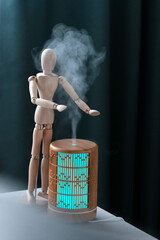 Wooden diffuser, yellow light, electric aromatic. A little blonde girl next to a wooden mannequin....