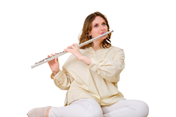 Happy woman with a flute is playing at home on the sofa in the living room, isolated on a white background