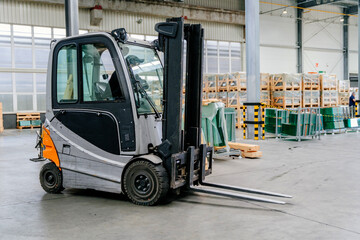 Forklift truck loader in factory. Glass factory, Production plant