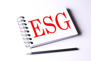 Text ESG on notebook on the white background, business