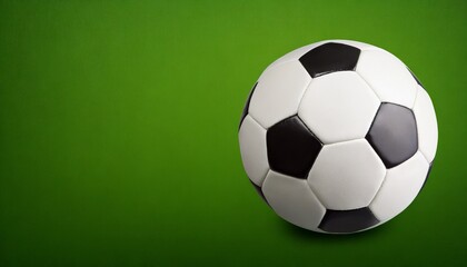 Soccer ball Isolated, green background, text space