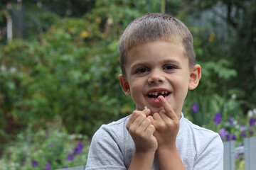Fototapeta premium The child lost a tooth. Selective focus.Concept baby tooth