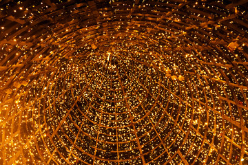 New Year's tree in the city of Lisbon. Christmas lights in Portugal. view inside the tree, orange...