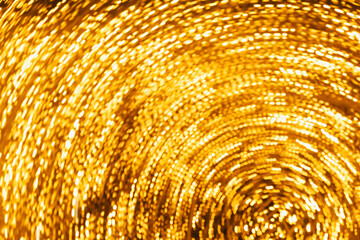 defocused orange and yellow glare garlands, New Year's tree in the city of Lisbon. Christmas lights in Portugal. blurred background.