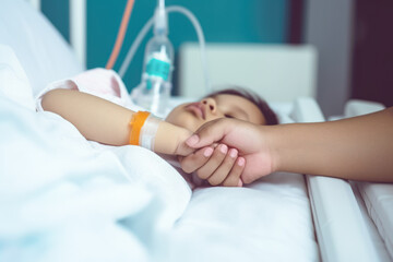 Mother hand holding child hand who have IV solution in the hospital with love and care