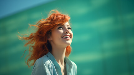 Portrait of a beautiful young female model in a green shirt, smiling happily and cheerfully. Modern and stylish. Hipster and urban. Hope and future. Copy space for text in the background.