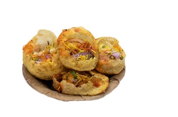 Panipuri or Golgappa in a Dry Leaves Disposable Bowl Isolated on White Background, Also Known as Gupchup, Paani Patashi, Water Pancakes, Gol Gappay, Fuchka, Phuchka, Water Ball - obrazy, fototapety, plakaty
