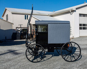 A Side View of a New Amish Buggy, Parked With Out a Horse, Waiting to be Sold on a Sunny Day