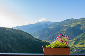 Fototapeta na wymiar Mountainscape Serenity: Green Peaks and Azure Skies