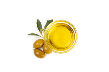 Bowl of fresh olive oil and olives with leaves isolated on white background. Delicious olive oil in a glass bowl. olive oil bottle.