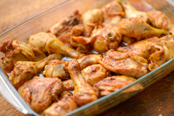 Prepared chicken legs and thighs seasoned and oven-roasted