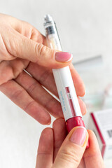 Close upshot of the woman preparing medicine for injection. Healthcare