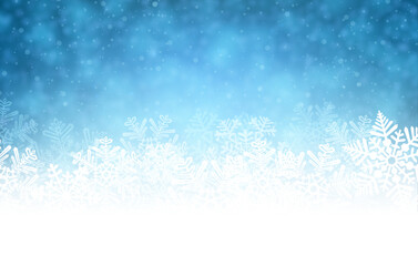 White rough snow background on blue textured pattern with blurred snowflakes.