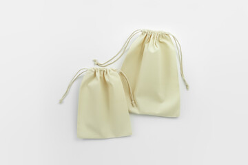 two cotton bags on a white background, top view. eco friendly storage concept