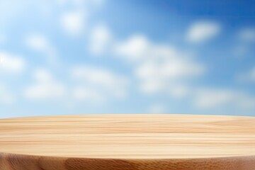 Wooden surface of new table on blue sky background with small,