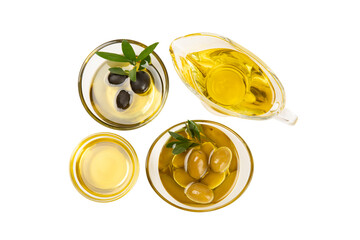 Bowl of fresh olive oil and olives with leaves isolated on white background. Delicious olive oil in a glass bowl. olive oil bottle.