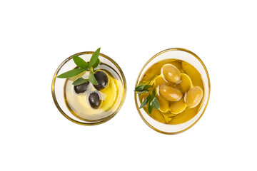 Bowl of fresh olive oil and olives with leaves isolated on white background. Delicious olive oil in a glass bowl. olive oil bottle.