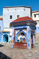 Painted fountain in al-Hawta square, in the medina of Chefchaouen, Morocco