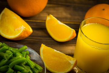 Naklejka na ściany i meble Orange slices and orange juice for a healthy diet