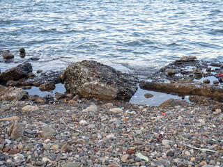  Sea at the port. Concrete slabs on the pier.