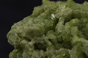 Vesuvianite Mineral Specimen on Dark Background, Displaying Rich Tones and Textures