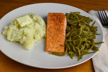 seasoned salmon  with mash potatoes and  french cut beans