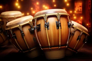 Fotobehang Conga drums arranged on a stage under dramatic lighting ready for a concert. Traditional percussion musical instrument of Afro-Cuban. Bright performance © Jafree