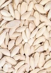 Pumpkin seeds on the white background. (Turkish name; kabak cekirdegi) Pumpkin seeds have a very high nutritional value