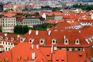 Fototapeta premium Old medieval houses, building, red tiled roofs in Prague, Czech Republic, panorama. Historical buildings in Prague Czechia