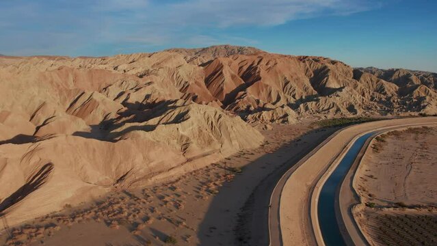 Mecca Hills Badlands and the Coachella Canal at sunset