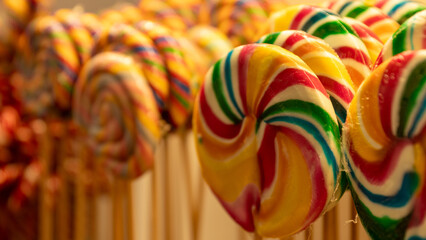 colorful lollipop on wooden background