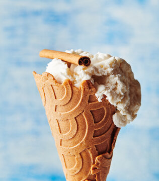 Vanilla ice cream on a cinnamon cone