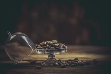 Fotobehang Aromatic coffee beans on a wooden table, coffee beans © Anton