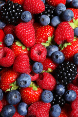 Assortment of fresh ripe berries as background, top view