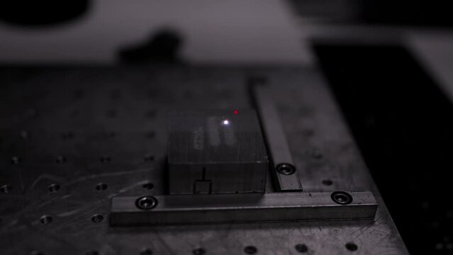 Video of a laser engraving the serial number and model of a metal piece