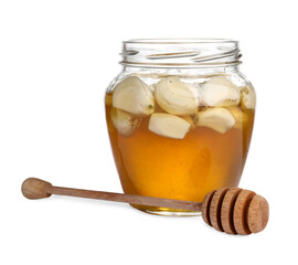 Honey with garlic in glass jar and dipper isolated on white