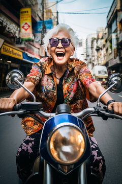 Cool grandma with funny face riding a bike on the streets. High quality photo