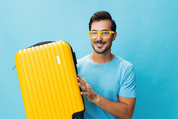 Man travel studio guy happy traveler journey trip yellow baggage flight weekend background vacation...