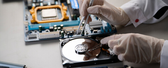 person in gloves work in laboratory, repair broken hdd hard drive - obrazy, fototapety, plakaty