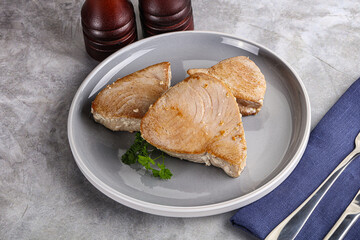 Roasted red tuna steak in the plate
