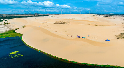 Stark geographical contrast between sand and water near Mui Ne, Vietnam. Mui Ne Desert of Vietnam...